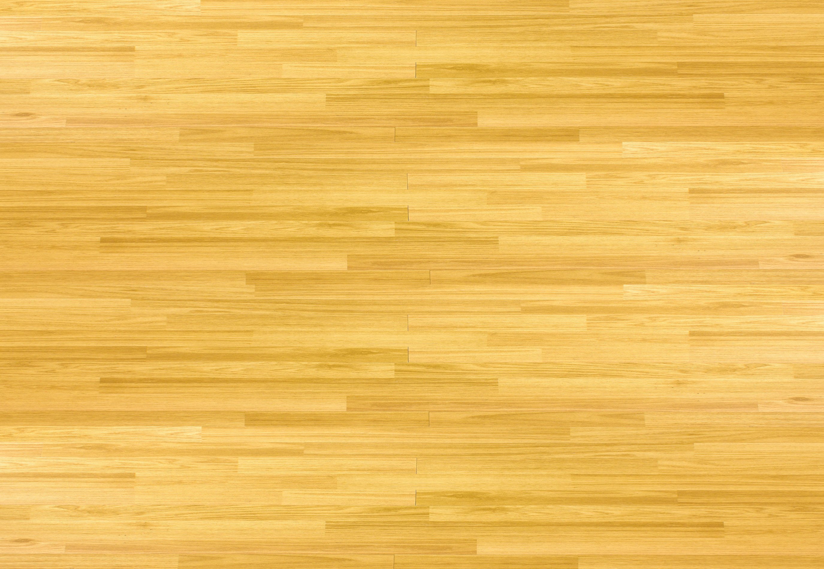 Hardwood maple basketball court floor viewed from above.