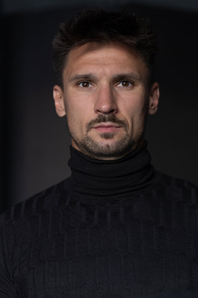 Portrait of a Man in Black Turtleneck Shirt